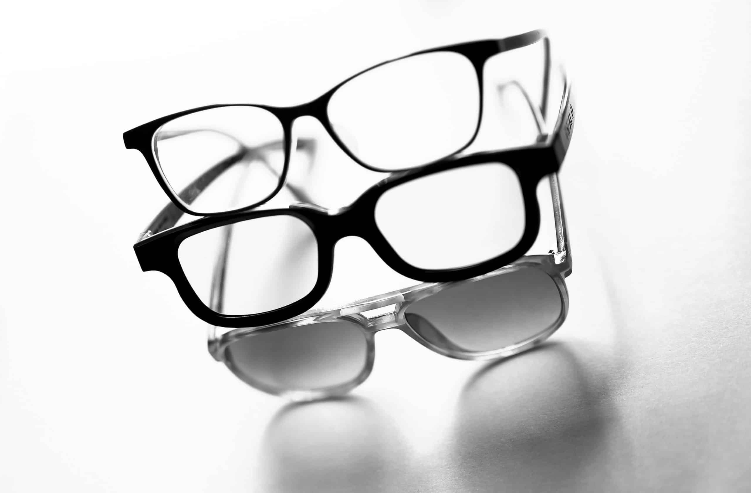 Three pairs of glasses representing the different types of varifocal lenses.